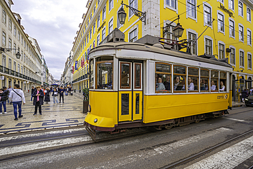 View of vintage No28 yellow tram in Lisbon city centre, Lisbon, Portugal, Europe