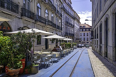 View of cafe and old tram lines in Lisbon city centre, Lisbon, Portugal, Europe