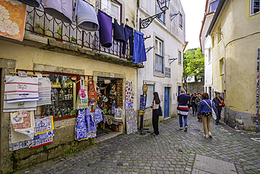 View of shop in narrow cobbled street close to Lisbon Castle, Alfama District, Lisbon, Portugal, Europe