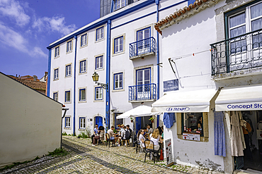 View of white washed cafe in Alfama, Alfama District, Lisbon, Portugal, Europe