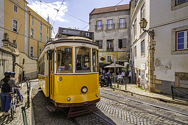 View of colourful architectecture and vintage tram in Alfama, Alfama District, Lisbon, Portugal, Europe