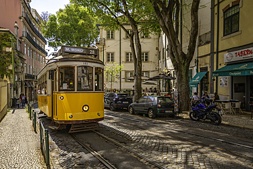 View of colourful architectecture and vintage tram in Alfama, Alfama District, Lisbon, Portugal, Europe