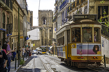 View of vintage tram and Lisbon Cathedral in Alfama, Alfama District, Lisbon, Portugal, Europe