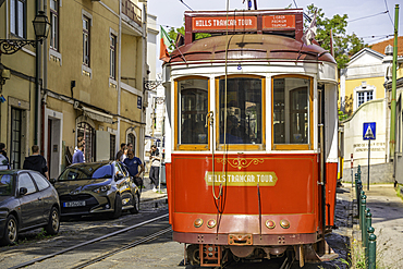 View of vintage tram narrow street in Alfama, Alfama District, Lisbon, Portugal, Europe