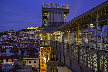 View of Lisbon Castle and Santa Justa Lift from Carmo Archaeological Museum during golden hour, Lisbon, Portugal, Europe