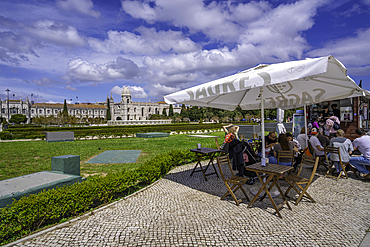 View of Jerónimos Monastery (Monastery of the Hieronymites) from Empire Square Garden on a sunny day, Lisbon, Portugal, Europe