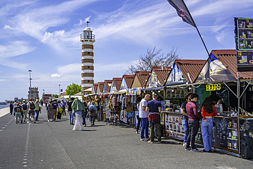 View of Belem Lighthouse and shops and stalls on a sunny day, Lisbon, Portugal, Europe