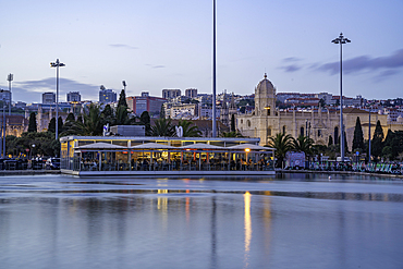 View of Jerónimos Monastery (Monastery of the Hieronymites) from Empire Square Garden at dusk, Lisbon, Portugal, Europe