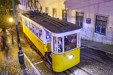 View of vintage Glória Funicular at dusk, hilltop tram ride, Lisbon, Portugal, Europe