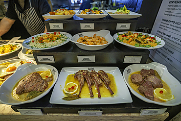 View of food on display in the food court in the interior of Time Out Market, Lisbon, Portugal, Europe
