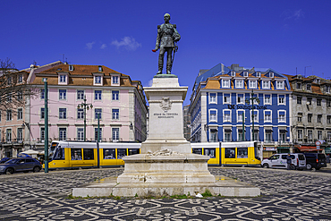 View of Duke of Terceira statue and a modern tram in PC Duque da Terceira on a sunny day, Lisbon, Portugal, Europe