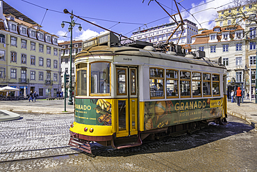 View of a vintage tram in PC Duque da Terceira on a sunny day, Lisbon, Portugal, Europe