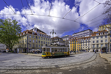 View of a vintage tram in PC Duque da Terceira on a sunny day, Lisbon, Portugal, Europe
