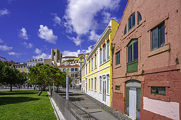 View of Lisbon Cathedral and colourful buildings in the Alfama District on a sunny day, Lisbon, Portugal, Europe