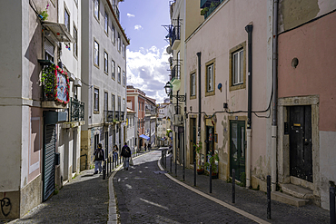 View of narrow street in the Alfama District on a sunny day, Lisbon, Portugal, Europe