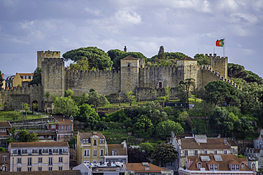 Panoramic view of Lisbon Castle from Miradouro da Senhora do Monte scenic point on a sunny day in the Alfama District, Lisbon, Portugal, Europe