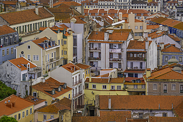 View of rooftops and colourful buildings from Miradouro da Senhora do Monte scenic point on a sunny day in the Alfama District, Lisbon, Portugal, Europe