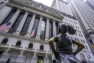 View of exterior of New York Stock Exchange and The Fearless Girl statue in Lower Manhattan, New York City, United States of America, North America