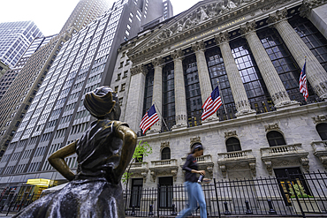 View of exterior of New York Stock Exchange and The Fearless Girl statue in Lower Manhattan, New York City, United States of America, North America