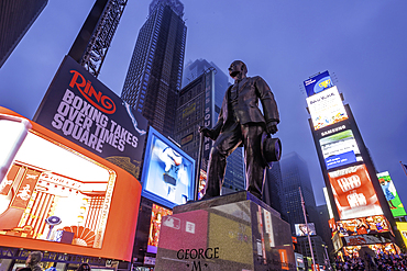 View of neon lights in Times Square at dusk, New York City, United States of America, North America