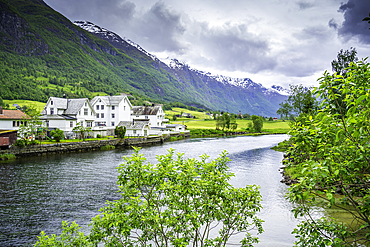 View of Olden village, mountains and Oldeelva river in Nordfjorden during summer, Norway, Scandinavia, Europe