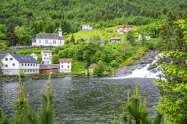 View of Sunnylven church and Hellesylt waterfall in Hellesylt, Sunnylvsfjorden, Stranda Municipality, Norway, Scandinavia, Europe