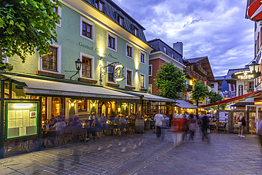 View of restaurants and cafes in Zell am See at dusk, Zell am See, Salzburg, Austria, Europe