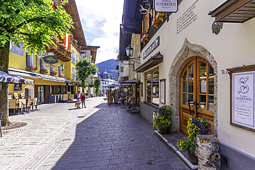View of restaurants and cafes and street scene in Zell am See on a sunny day, Zell am See, Salzburg, Austria, Europe
