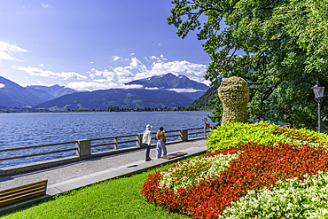 View of garden overlooking Lake Zell in Zell am See on a sunny day, Zell am See, Salzburg, Austria, Europe