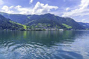 View of Zell am See and Lake Zell from cruise boat on a sunny day, Zell am See, Salzburg, Austria, Europe