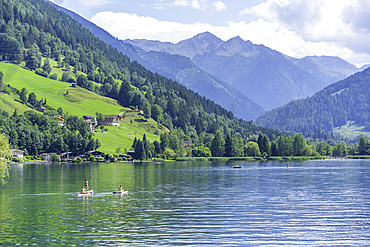 View of mountains and Lake Zell from cruise boat on a sunny day, Zell am See, Salzburg, Austria, Europe