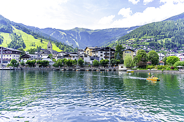 View of the Grand Hotel and Lake Zell from cruise boat on a sunny day, Zell am See, Salzburg, Austria, Europe