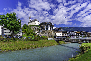 View of Kaprun town and church on the hill on a sunny day, Kaprun, Salzburg, Austria, Europe