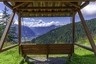 View of Kaprun and mountains toward Grossglockner from Plettsaukopf Reservoir on a sunny day, Bruckberg, Salzburg, Austria, Europe