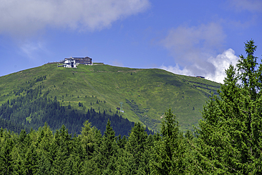 View of Schmittenhöhebahn top station 2000m from Plettsaukopf Reservoir on a sunny day, Bruckberg, Salzburg, Austria, Europe