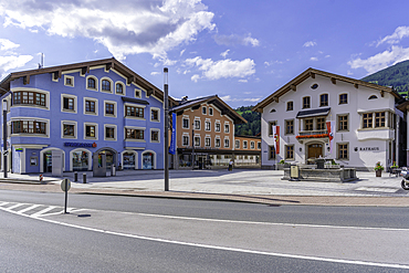View of colourful buildings and Rathaus in Stadtplatz Mittersill on a sunny day, Salzburg, Austria, Europe