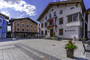 View of colourful buildings and Rathaus in Stadtplatz Mittersill on a sunny day, Salzburg, Austria, Europe