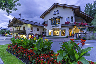 View of shops in Kaprun at dusk during summer, Kaprun, Zell am See, Salzburg, Austria, Europe