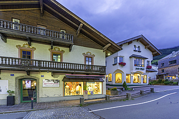 View of shops in Kaprun at dusk during summer, Kaprun, Zell am See, Salzburg, Austria, Europe