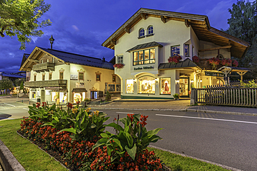 View of shops in Kaprun at dusk during summer, Kaprun, Zell am See, Salzburg, Austria, Europe