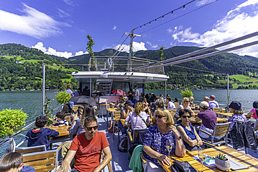 View of people on tour boat on Lake Zell in Zell am See on a sunny day, Zell am See, Salzburg, Austria, Europe