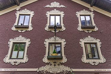 View of colourful facade of chelet in Saalfelden on a sunny day, Zell am See, Salzburg, Austria, Europe