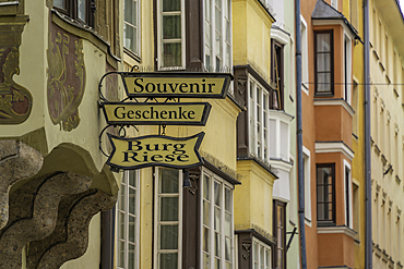 View of ornate signage in Herzog-Friedrich-Straße in the old town of Innsbruck on a sunny day in summer, Innsbruck, Tyrol Region, Austria, Europe