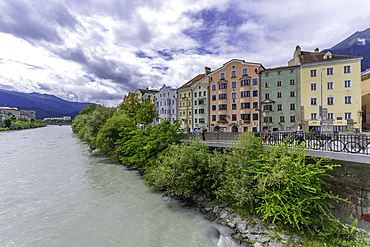 View of colourful buildings and River Inn on a sunny day in summer, Innsbruck, Tyrol Region, Austria, Europe