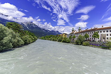 View of St. Jakob Cathedral, colourful buildings and River Inn on a sunny day in summer, Innsbruck, Tyrol Region, Austria, Europe
