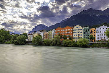 View of colourful buildings and River Inn at sunset in summer, Innsbruck, Tyrol Region, Austria, Europe