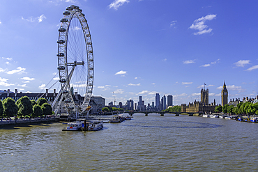 View of London Eye, Houses of Parliament and Big Ben clocktower from Golden Jubilee Bridge during summer, Westminster, London, England, United Kingdom, Europe
