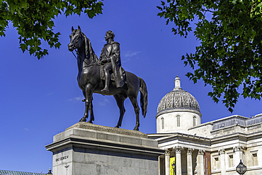 View of Equestrian Statue of King George IV and National Galery in Trafalgar Square during summer, Westminster, London, England, United Kingdom, Europe