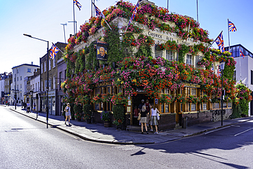 View of the The Churchill Arms, Kensington during summer, Kensington, London, England, United Kingdom, Europe