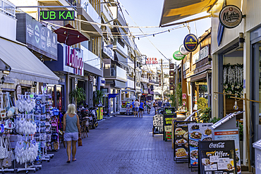 View of shops on main street, Limenas Chersonisou, Crete, Greek Islands, Greece, Europe